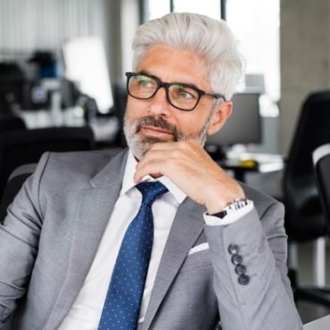demo-attachment-169-mature-businessman-in-gray-suit-in-the-office-PSEXZSV